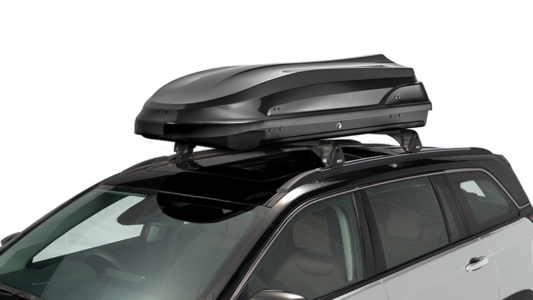 Black Jeep roof-mounted carrier luggage box for extra storage – durable, aerodynamic, and weather-resistant design.